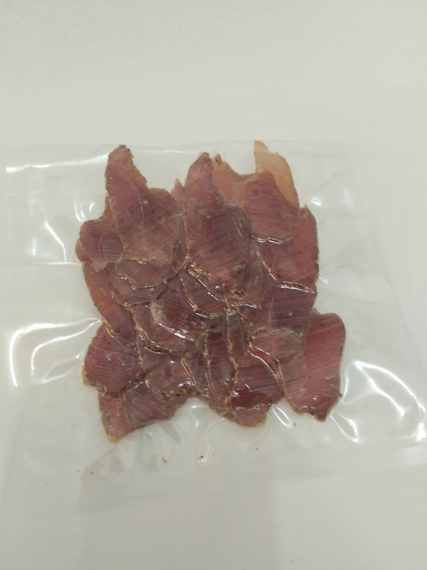 Luftgetrocknete Schweinelende mediterrane Art, geschnitten